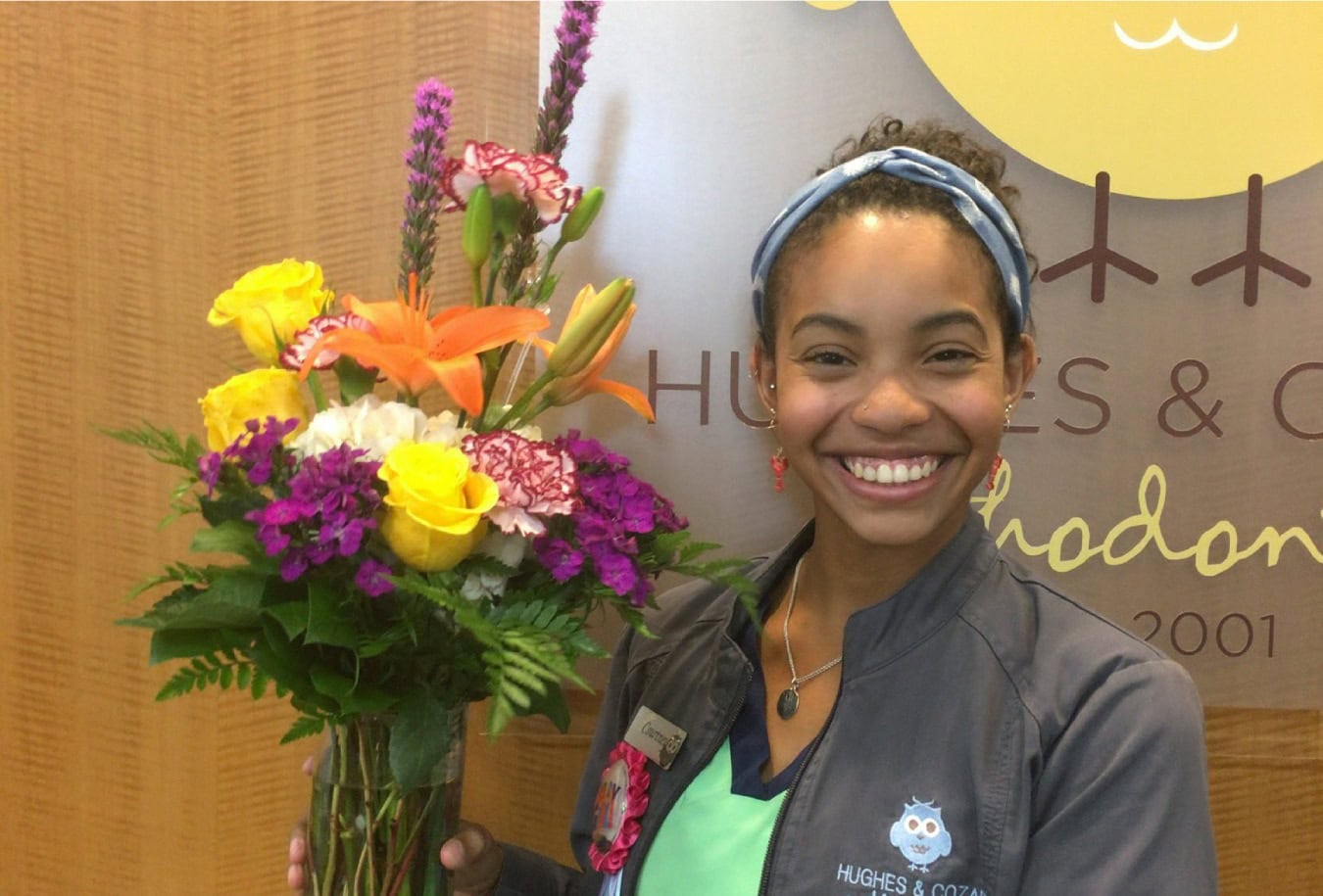 Team member holding flowers