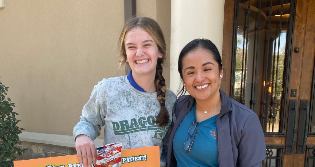 Team member smiling with young patient